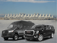 two vans in front of a building in denver